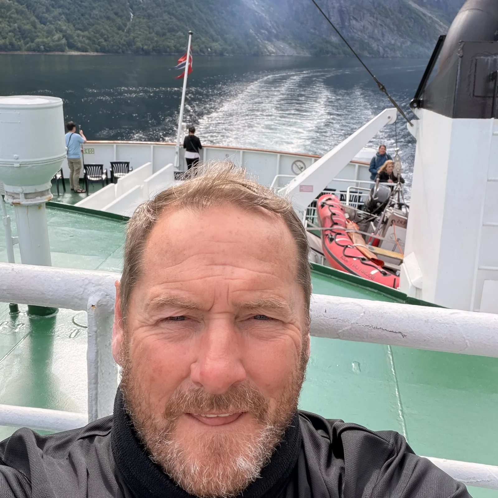 James on a ferry in a Norwegian fjord